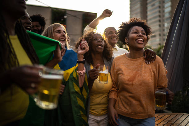 istock Brazilian team fans celebrating on a rooftop bar 1425864234