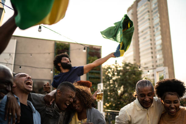 istock Brazilian team fans celebrating on a rooftop bar 1425865779