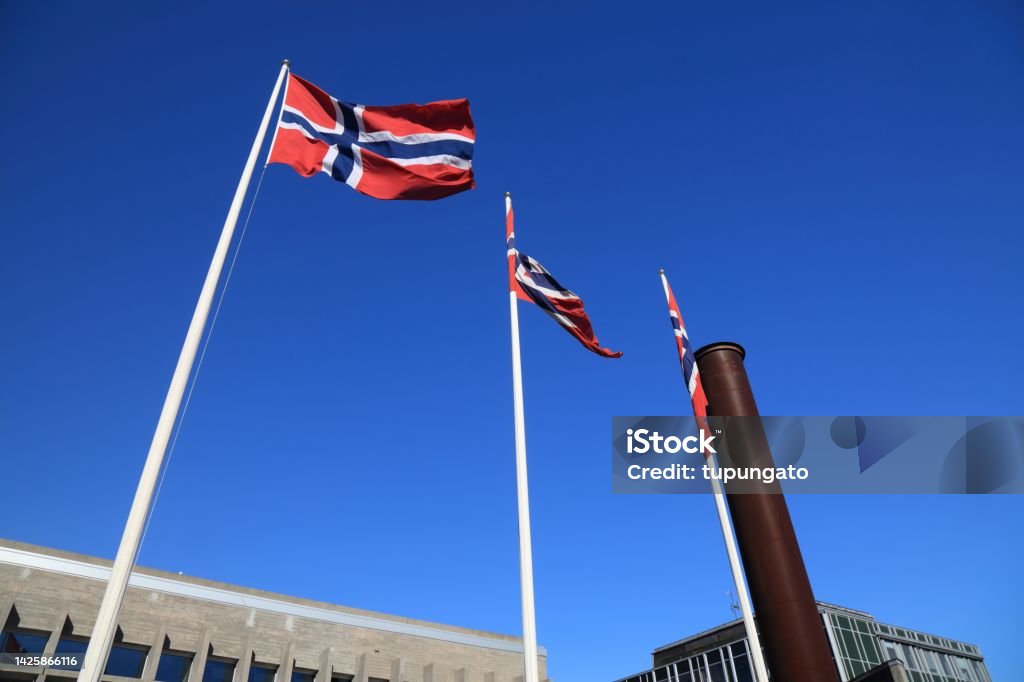 Flag of Norway Flag of Norway in the wind. Norwegian national symbol. Architecture Stock Photo