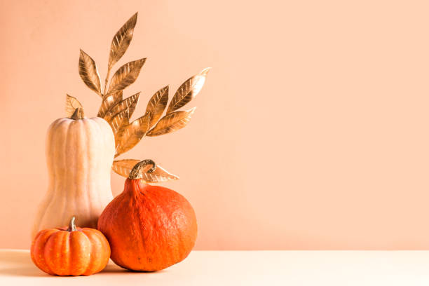 istock Pumpkins and autumn golden leaves 1425866628