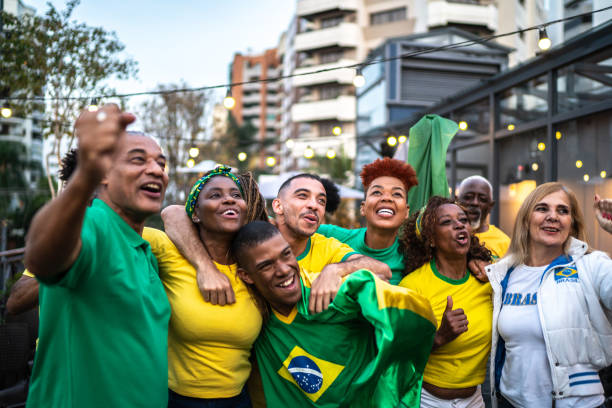 istock Brazilian team fans celebrating on a rooftop bar 1425867209