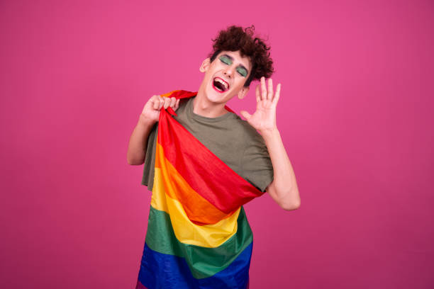 istock Happy guy with a gay flag in his hands. 1425867231