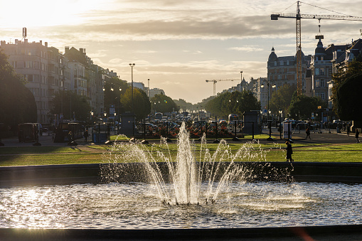London, UK - September 3 2023:  people gather around the fountains in Trafalgar Square on a warm day