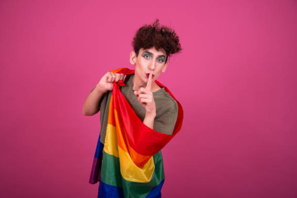 istock Happy guy with a gay flag in his hands. 1425868339
