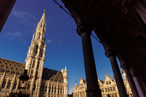 A Brussels street scene of Brussels Town Hall or Hôtel de Ville and Houses in Grand Place taken from the Grand Place Brussels, Belgium