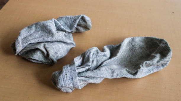 istock Unwashed gray socks, on the floor 1425872287