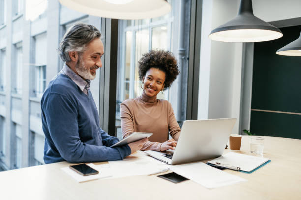 istock Diverse experts working together in office and analysing market performance 1425873400