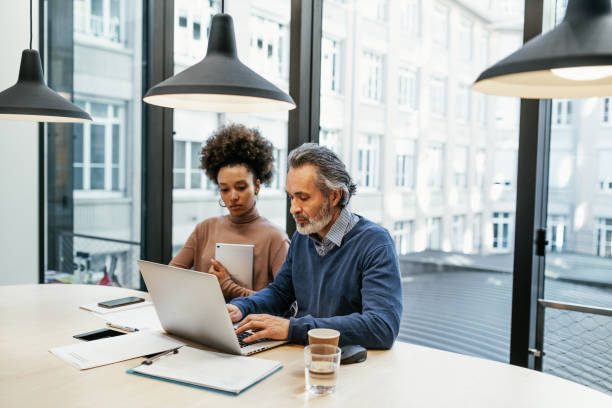 istock Financial experts working together in office and analysing market performance 1425873413