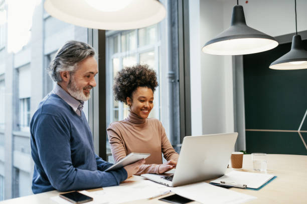 istock Financial experts working together in office and analysing market performance 1425873422