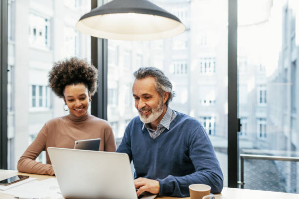 istock Financial experts working together in office and analysing market performance 1425873517