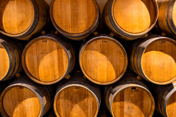 istock Stacked wine barrels. Wooden barrels containing macerating wine. 1425877086