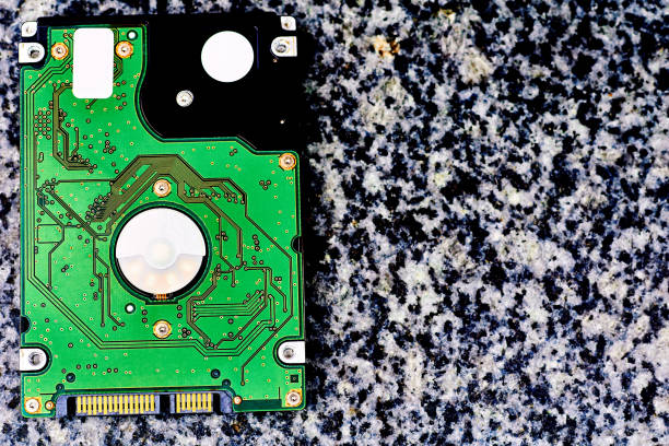 istock Internal hard drive for storing information on a black white marble surface 1425877119