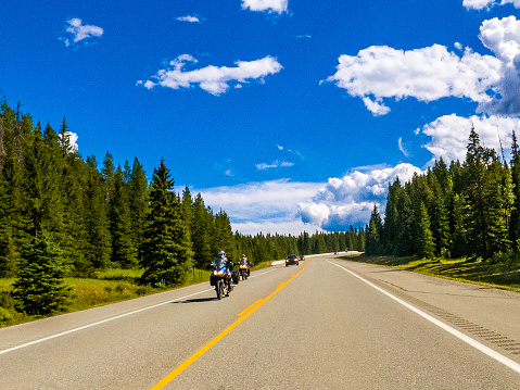 Motorcyclist riding through Banf National Park