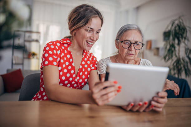 istock Grandmother and granddaughter use tablet 1425889068