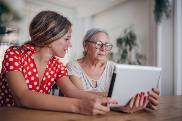 istock Grandmother and granddaughter use tablet 1425889274
