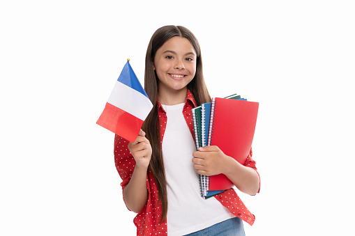 happy teen girl hold french flag and school copybook for studying isolated on white, education abroad.