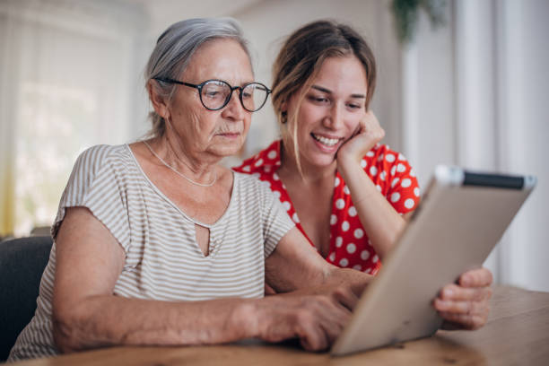 istock Grandmother and granddaughter use tablet 1425889315