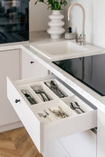 istock Modern kitchen with clean silverware cutlery in open drawer 1425889393