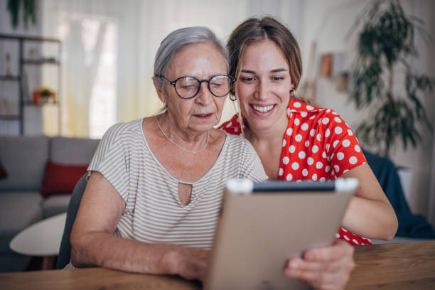 istock Grandmother and granddaughter use tablet 1425889626