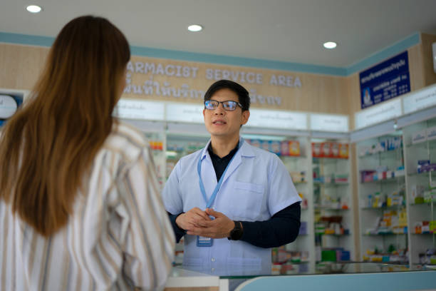 istock Customer is consulting the pharmacist at pharmacy store. 1425889685
