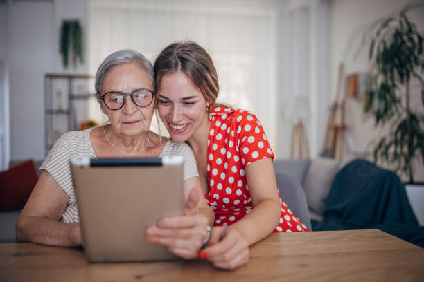 istock Grandmother and granddaughter use tablet 1425889752