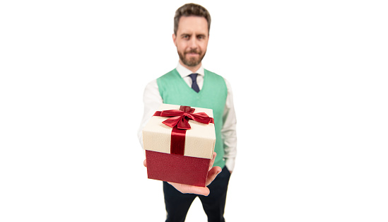 present for womens day. successful ceo holding giftbox. handsome man prepare for romance date. happy man with business reward. occasion greeting. businessman showing gift box. selective focus.
