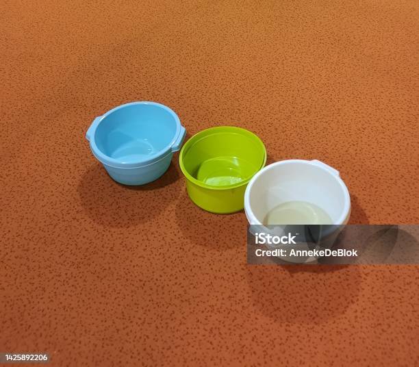 Washingup Bowls With Water For A Leak Int The Ceeling Stock Photo - Download Image Now