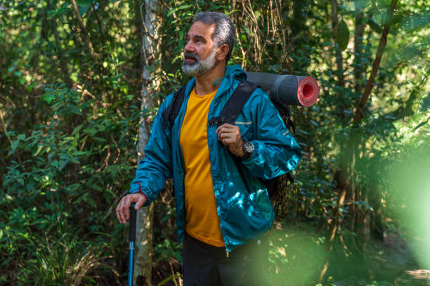 istock Senior man hiking in a mountain forest 1425893118