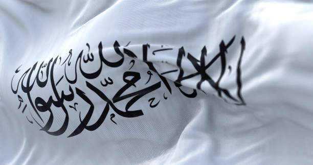 the flag of the islamic emirate of afghanistan waving in the wind. - jihad imagens e fotografias de stock