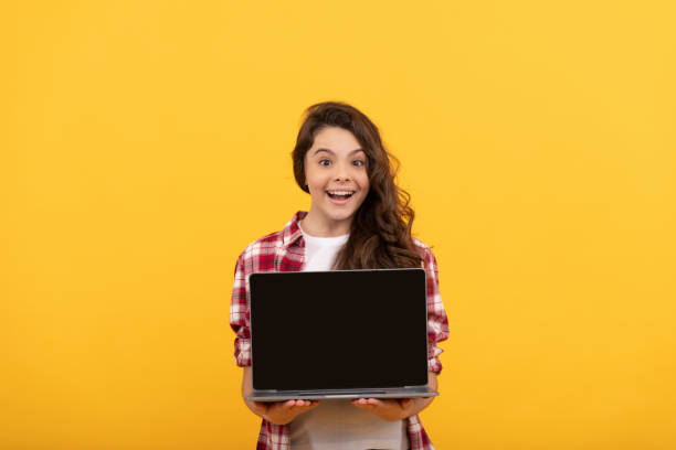istock amazed smart child presenting laptop at school online lesson, school presentation 1425894694