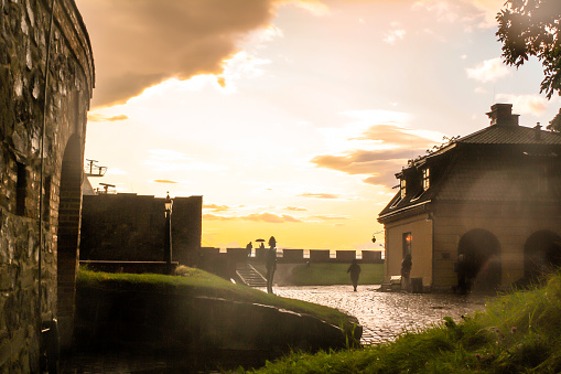 Oslo, Norway - August, 2019: sunset after the rain atAkershus Fortress/ Castle. The castle was built around somewhere in the 1290's by King Haakon V. It has  functioned as a prison and a military base, currently it's also temporary housing for the Prime Minister.