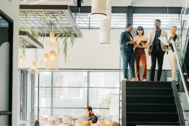 istock Teamwork, collaboration and support in office with business people discuss strategy in a marketing or advertising company. Diversity, happy and creative workers working together and planning at work 1425898982