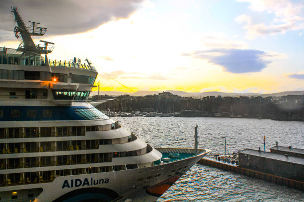 Oslo, Norway - August, 2019: The AIDA Luna cruise ship in the harbour, graininess comes from the rain.