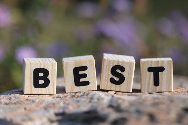 Word BEST from wooden blocks on the rock