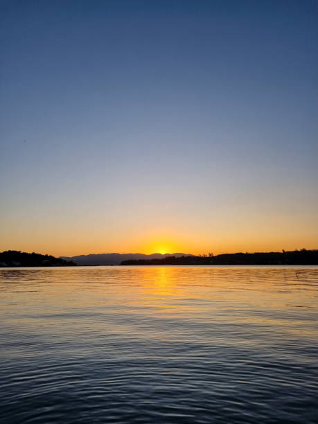 istock Sunset lagoon and mountains landscape 1425901358