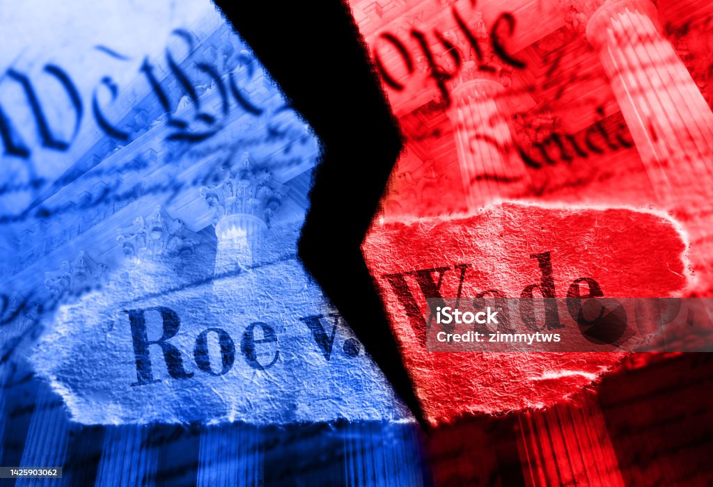 Torn red and blue Roe V Wade newspaper headline on the United States Constitution and Supreme Court Torn Roe V Wade newspaper headline in red and blue on the US Constitution with the United States Supreme Court in background Roe v. Wade Stock Photo