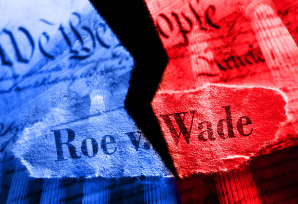 Torn red and blue Roe V Wade newspaper headline on the United States Constitution and Supreme Court Torn Roe V Wade newspaper headline in red and blue on the US Constitution with the United States Supreme Court in background reproductive rights stock pictures, royalty-free photos & images