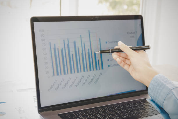 istock Businessman looking at charts 1425903064