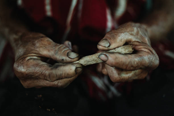 istock Hmong Hilltribe Old Man Rolling Cigarette Chiang Mai, Thailand Farmer 1425913695