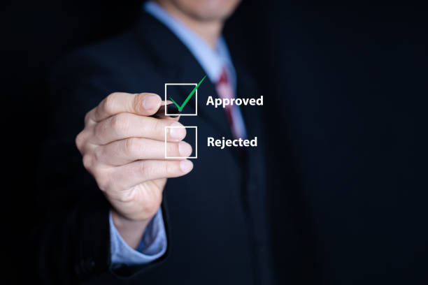istock business man choose approved checking box 1425915190
