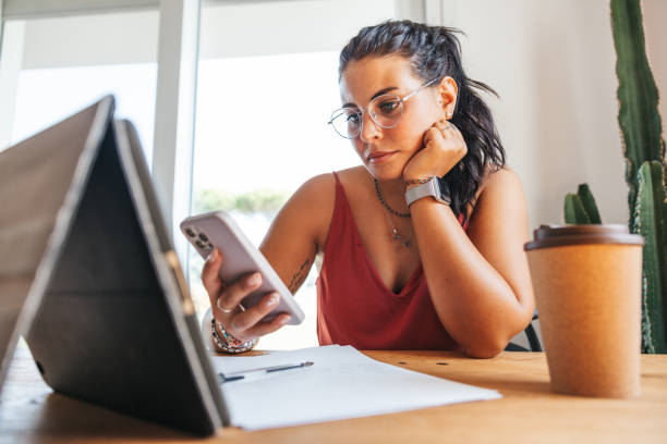 Millennial studying taking part ot a online class from home stock photo