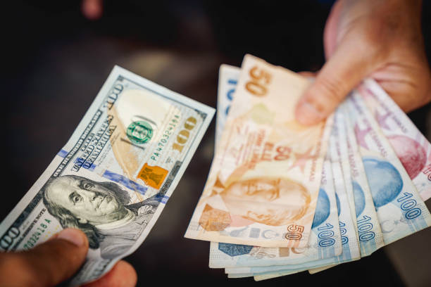 istock Exchanging Turkish Liras with United States Dollar Bill 1425921680