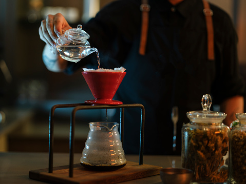 a barista brewing coffee in a cafe