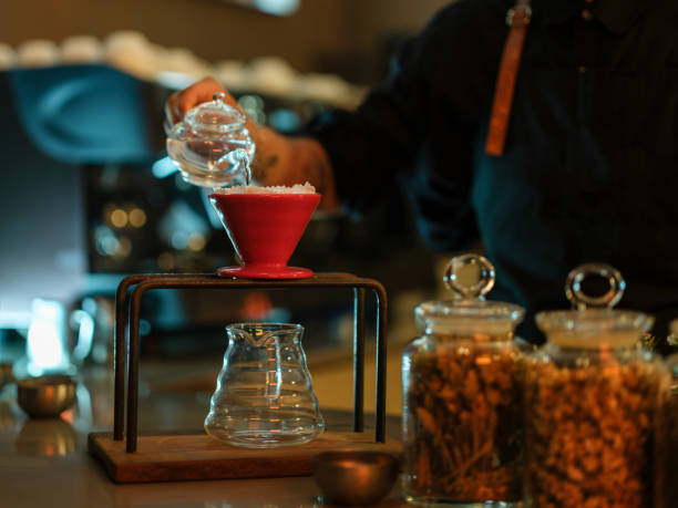 istock a barista brewing coffee in a cafe 1425927709
