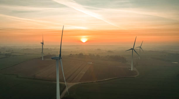 istock Wind turbines in a wind farm at sunrise 1425927836