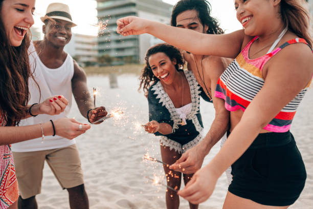 istock friends doing a party at the beach 1425929651