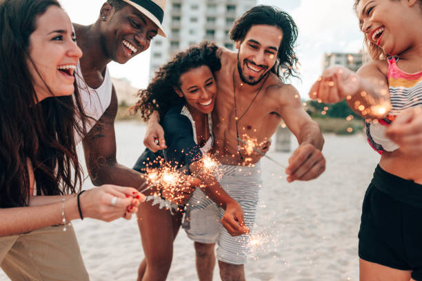 istock friends doing a party at the beach 1425929835