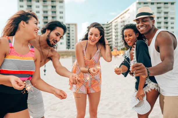 istock friends doing a party at the beach 1425929949