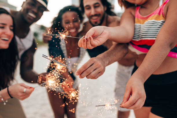 istock friends doing a party at the beach 1425930186