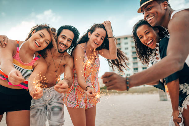istock friends doing a party at the beach 1425930251